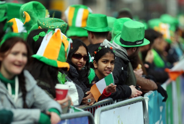The crowd waits for the start of the St Patrick's Day parade on the streets of Dublin. 