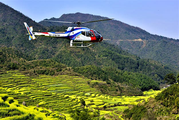 Travel News - canola Huangling village in China’s Jiangxi Province launched helicopter tours from 11 March.