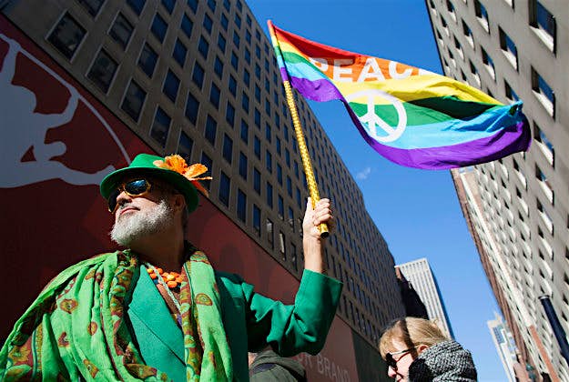 Travel News - pic 7 Steven Menendez waves a gay pride flag at the St Patrick's Day parade in NYC