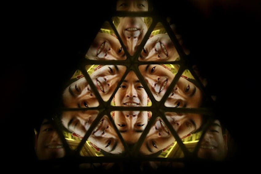 Travel News - Edinburgh International Science Festival University of Edinburgh student Kengo Shibata is photographed through the "Six Planet" Kaleidoscope