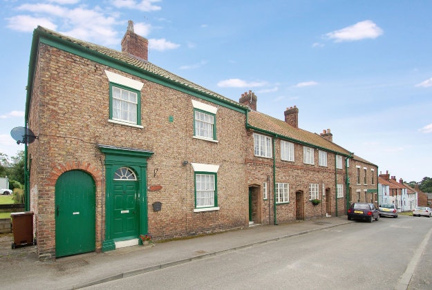 Properties in High Street, as part of a sale for the West Heslerton Estate, Malton, North Yorkshire with an estimate of £20 million.