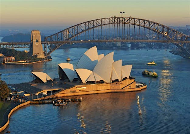 Travel News - Overview of Opera House and Harbour Bridge at dusk. Overview of Opera House and Harbour Bridge at dusk.