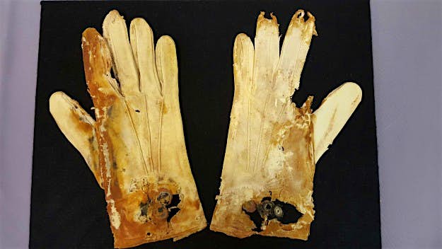 Travel News - pair-of-gloves-1-HR This degraded pair of cotton gloves was originally white and probably belonged to a gentleman. They are still attached at the cuff, so they had not yet been worn.