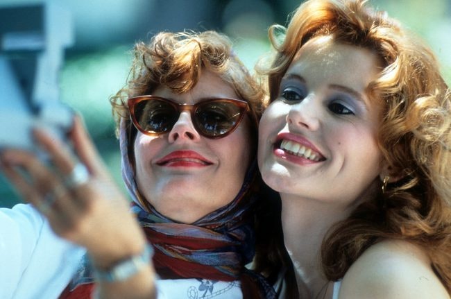Susan Sarandon and Geena Davis taking Polaroid of themselves in a scene from the film 'Thelma & Louise', 1991. (Photo by Metro-Goldwyn-Mayer/Getty Images)