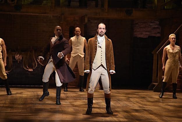 Travel News - The 58th GRAMMY Awards - "Hamilton" GRAMMY Performance Actor Leslie Odom, Jr. (L) and actor, composer Lin-Manuel Miranda (R) perform on stage during "Hamilton" GRAMMY performance for The 58th GRAMMY Awards at Richard Rodgers Theater on February 15, 2016 in New York City.