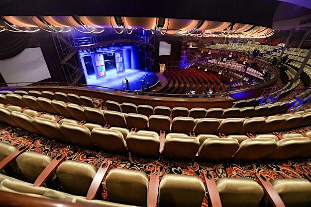 Travel News - FRANCE-SHIPYARD-TOURISM-INDUSTRY A picture taken on May 12, 2016 at the STX shipyard of Saint-Nazaire, western France shows the auditorium inside the Harmony of the Seas cruise ship during the delivery ceremony of the boat. With a capacity of 6.296 passengers and 2.384 crew members, the Harmony of the Seas, built by STX France for the Royal Caribbean International, is the world's largest ship cruise.
