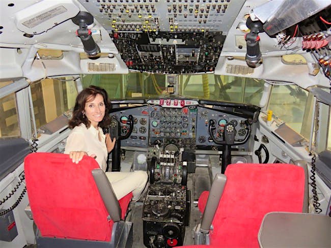 Travel News - Tracey Curtis-Taylor doing flight simulation training. Image: Bird in a Biplane