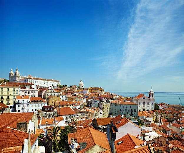 Travel News - Overview of Alfama district beside Tagus River estuary. Overview of Alfama district beside Tagus River estuary.