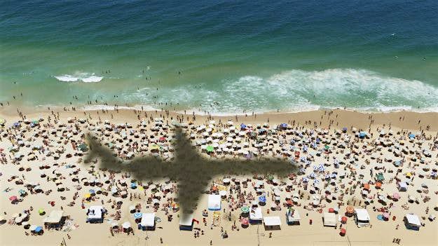 Travel News - airplane's shadow over a crowded beach The jet used will be one that