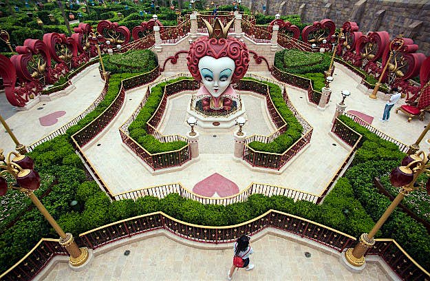 Travel News - GettyImages-540277758 A girl walks in 'Alice in Wonderland Maze' at Shanghai Disney Resort in Shanghai on June 15, 2016. The Magic Kingdom comes to the Middle Kingdom this week when Disney opens its first theme park in mainland China, betting the growing middle class will spend big on leisure despite a slowing economy.