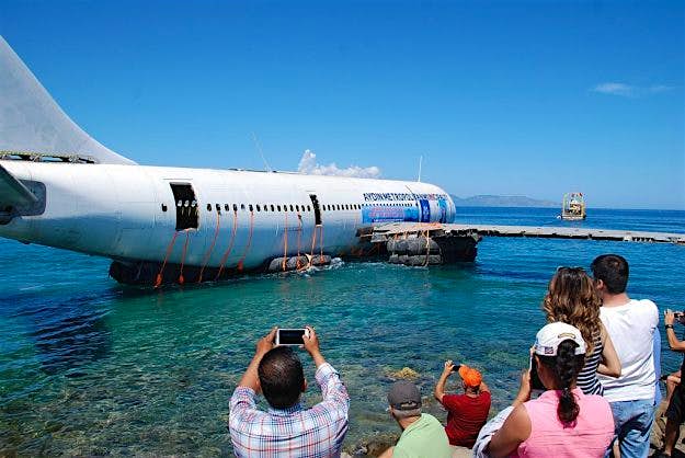 Travel News - Airbus to be sunk off Turkish coast for diving tourism People gathered to watch the Airbus be sunk into the sea
