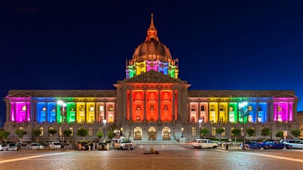 Travel News - shutterstock_144094330 San Francisco City Hall illuminated in rainbow colors in honor of Pride Week, 2013.