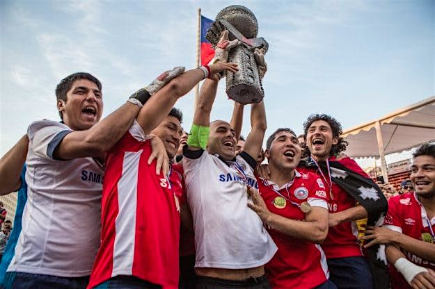 Travel News - homelessworldcup.org Santiago2014_AlexWalker-8-800x533 Team Chile celebrating victory at the 2014 Santiago Homeless World Cup. Image: Alex Walker