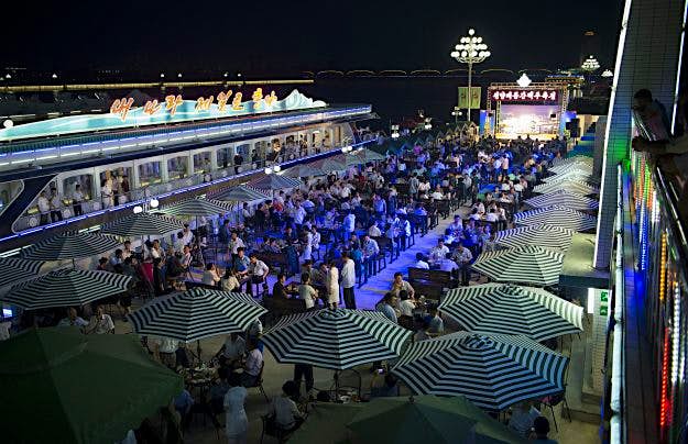 Travel News - NKOREA-FOOD-DRINK-BEER-FESTIVAL A general view of guests attending the opening of the Pyongyang Taedonggang Beer Festival where they were served fried chicken and free beer.