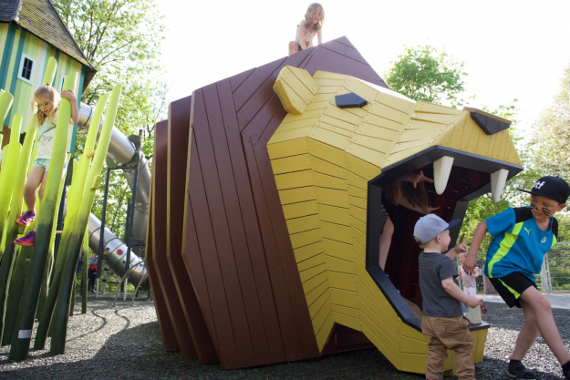 The playground is inspired by the Gobi desert and also features a tourist bus.