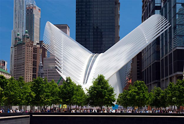 Travel News - Oculus GettyImages-650080591 The Oculus, a soaring white modern glass and steel structure that is the World Trade Center Transportation Hub, stands across from the National September 11 Memorial (foreground).
