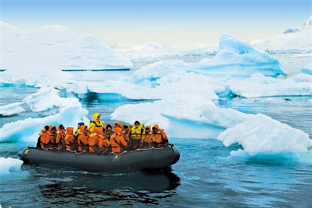 Travel News - Seabourn-passengers-on-zodiac Passengers explore the Antarctic on board the Zodiac lander.