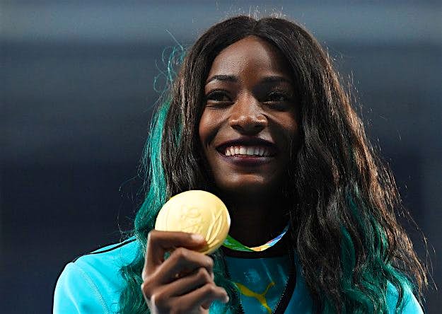 Travel News - Athletics - Olympics: Day 11 Gold medalist Shaunae Miller of the Bahamas with her medal for the Women's 400m Final