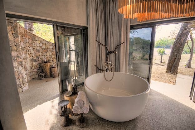 Travel News - Matetsi-River-Lodge2.jpg Stone, copper and wood are used in the interiors, echoing the materials and minerals of the region.