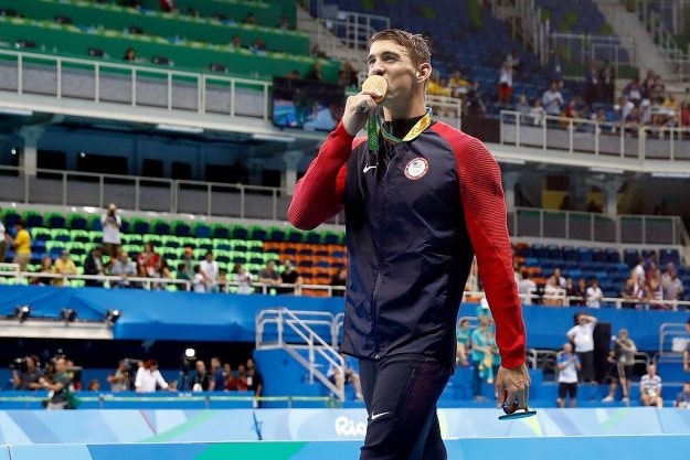 Michael Phelps takes gold at the Aquatic Stadium which was not filled to capacity. 