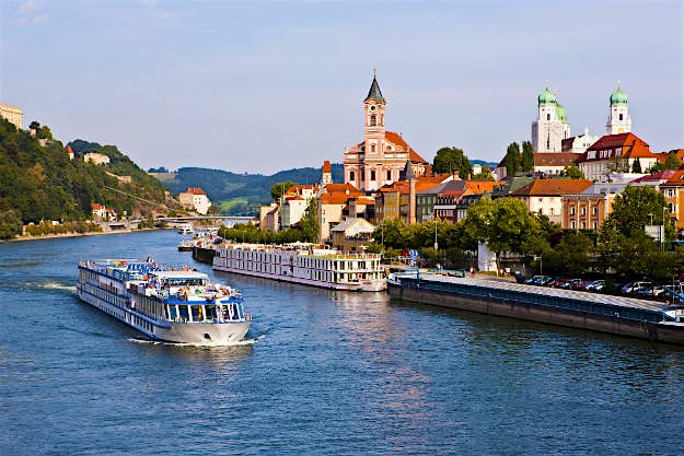Travel News - GettyImages-175837749 Cruise ship passing on the River Danube, Passau, Bavaria, Germany, Europe.