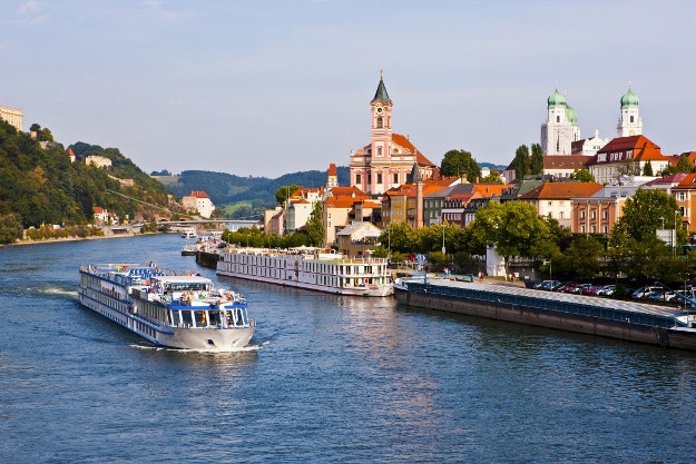Cruise ship passing on the River Danube, Passau, Bavaria, Germany, Europe. 