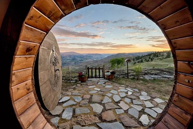 The Hobbit hole offers stunning views of the surrounding mountainside.