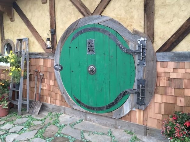 The house has the iconic round door from JRR Tolkien's The Hobbit and The Lord of the Rings .