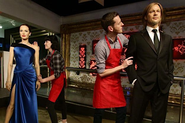 Travel News - madame-tussauds-pitt-jolie Studio assistants Alex Cameron and Olivia Steen were tasked with the sad task of "diplomatically" moving Brangelina's waxworks apart. Image: PA