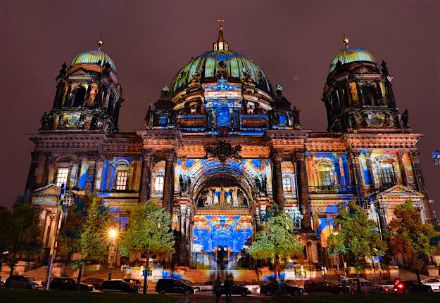 Travel News - GERMANY-ART-FESTIVAL-LANDMARK Designs are projected on the facade of the Berlin Cathedral (Berliner Dom).