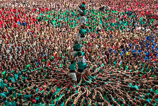 Travel News - Human Towers Are Built In The Tarragona Castells Competition Members of the colla 'Castellers de Vilafranca' fall down as they built a human tower during the 26th Tarragona Competition on October 2, 2016 in Tarragona, Spain. The 'Castellers' who build the human towers with precise techniques compete in groups, know as 'colles', at local festivals with aim to build the highest and most complex human tower.