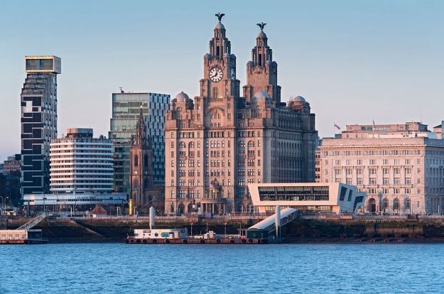 The Liver Building and Pier Head viewed across the River Mersey, Liverpool, England. 