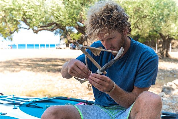 Travel News - SUP -110 Jay makes a small boat out of driftwood.