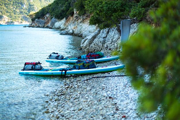 Travel News - SUP -84 Red Paddle boards on the shore.