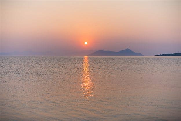 Travel News - sup-91 The soft sunlight over the Greek water.