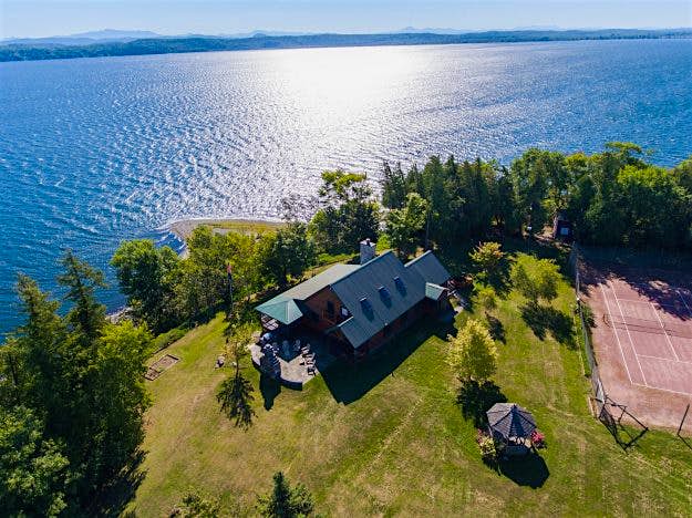 Travel News - 1 Cedar Island | South Hero, VT | Luxury Real Estate Cedar Island in Vermont is up for auction. Image: Concierge Auctions