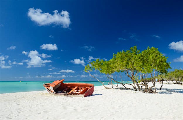 Travel News - aruba Abandoned boat on Palm Beach, Aruba.