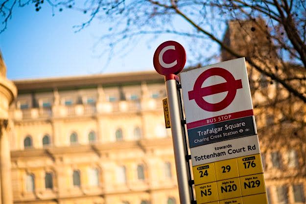 Travel News - Trafalgar Square Bus Stop Sign Hi-tech bus stops that zap air pollution could be coming to London. Image: Halbergman/Getty Images