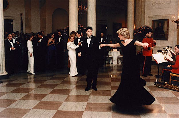 Travel News - gettyimages-618251740 John Travolta twirls Princess Diana on the dance floor while at a White House banquet. Ronald and Nancy Reagan can be seen in the background.