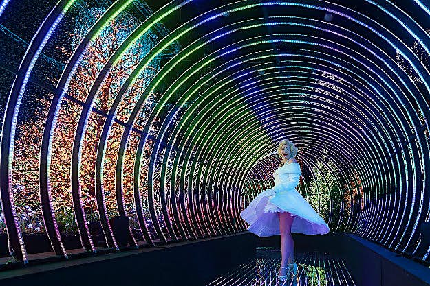 Travel News - gettyimages-623797144 A Marilyn Monroe impersonator poses for a photo inside the Rainbow Connection light display.