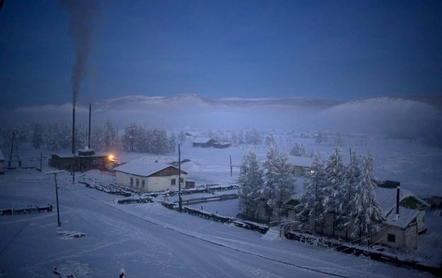 Oymakon village at dawn. The heating plant and its constant plume of coal smoke at left.