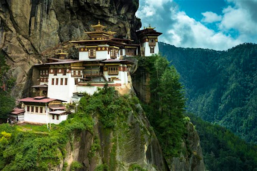 Travel News - 500px Photo ID: 103730883 - PARO, BHUTAN - AUGUST 11, 2014: Paro Taktsang Monastery is the most famous buddhist temple complex of Bhutan which clings to a cliff, 3120 meters above the sea level on the upper side of Paro valley, Bhutan. Paro valley, Bhutan.