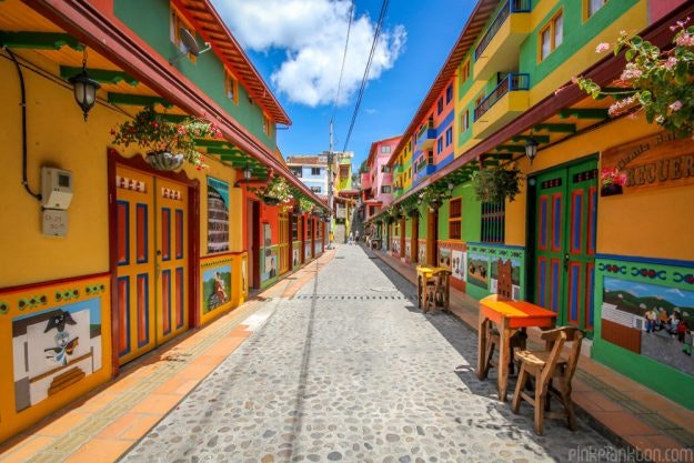 The colourful town features painted doors, buildings and furniture throughout.