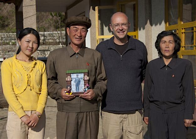 Travel News - expix_airbnb_in_north_korea10 Eric with his host family at the North Korean Airbnb