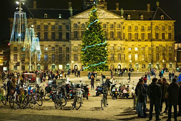 Travel News - Netherlands, Amsterdam, Exterior Dam Square and the Royal Palace, Amsterdam, The Netherlands. Image: Walter Bibikow