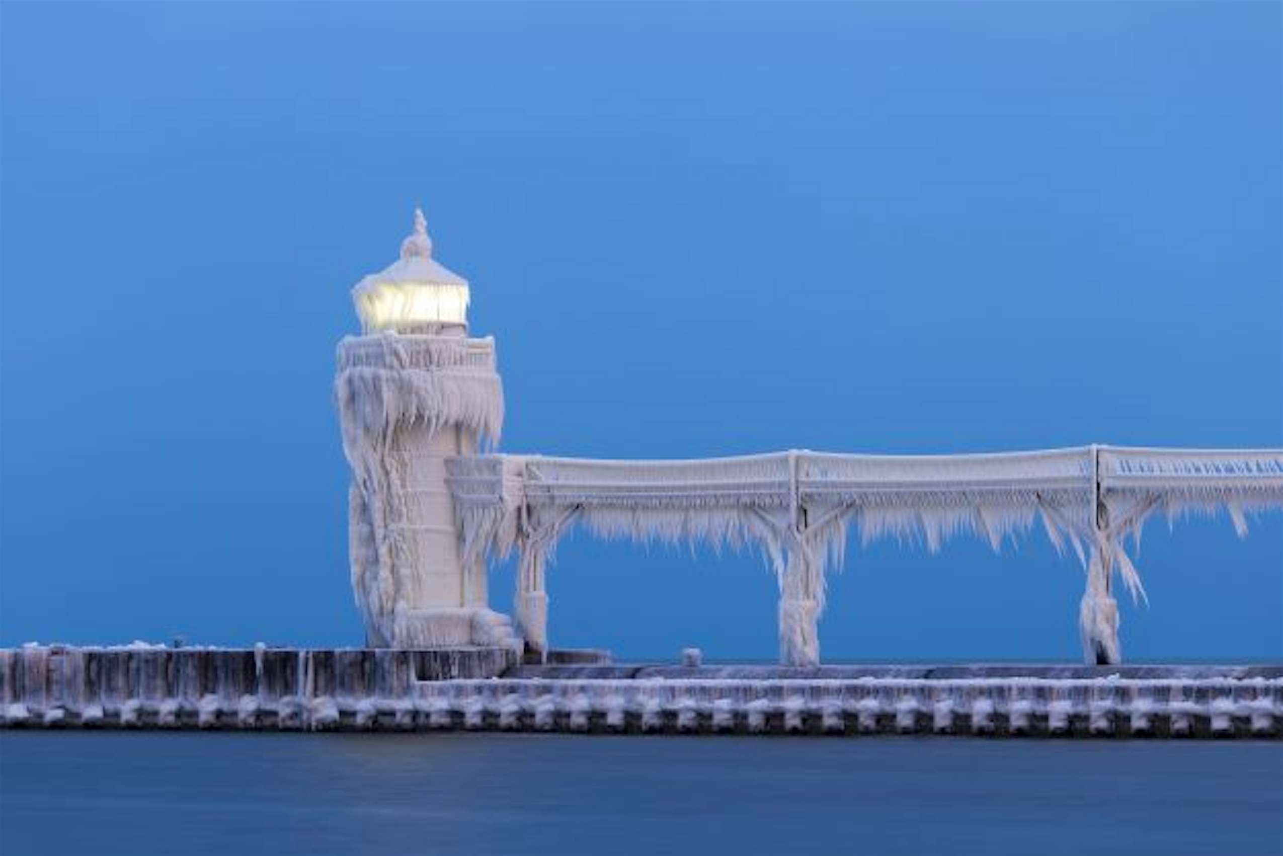 Stunning photos of Lake Michigan lighthouse encased in ice
