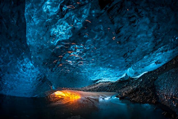 Travel News - Ice Tourists The spectacular collection of images show the explorers braving the freezing temperatures to climb, photograph and even abseil down the inside of the icy cliff sides.
