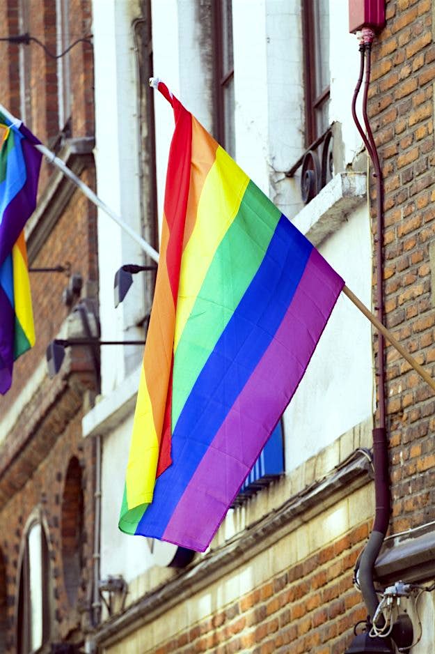 Travel News - Rainbow flag gay friendly A rainbow flag hanging from a window in Brussels.