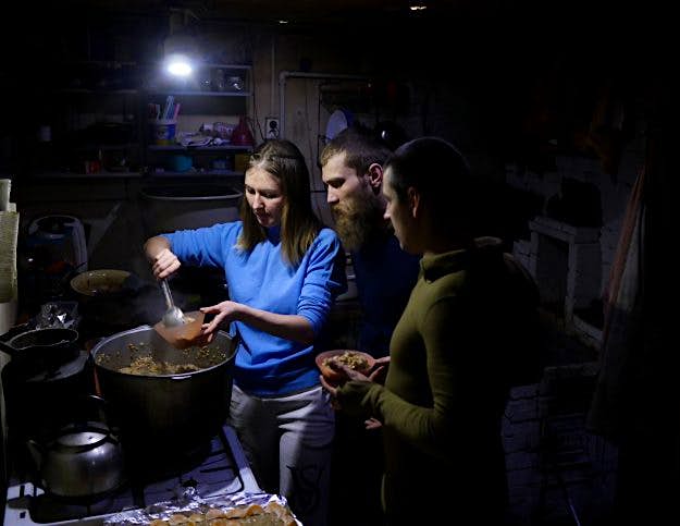 Travel News - Julia Gasheva serving dinner. Julia Gasheva serving dinner to the group.