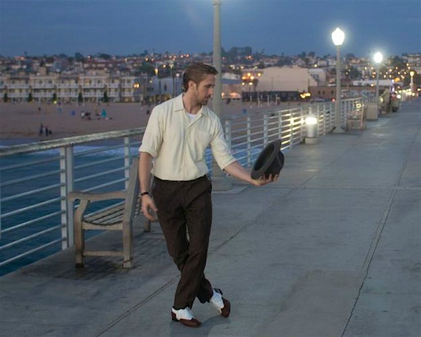 Travel News - lala5 Sebastian and his hat stroll Hermosa Pier and he sings "City of Stars" in La La land. Image: Summit Entertainment